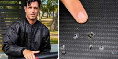 Dave Seymour mostra marcas de dentes de tubarão na sua prancha e-foil danificada
